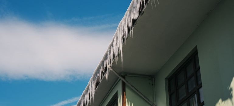 Ice on the roof as one of the common causes of roof leaks in Edmonton